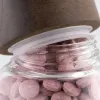 Pink tablet glass bottle portable storage bottle for medicines and health products packaging container Application Scenario